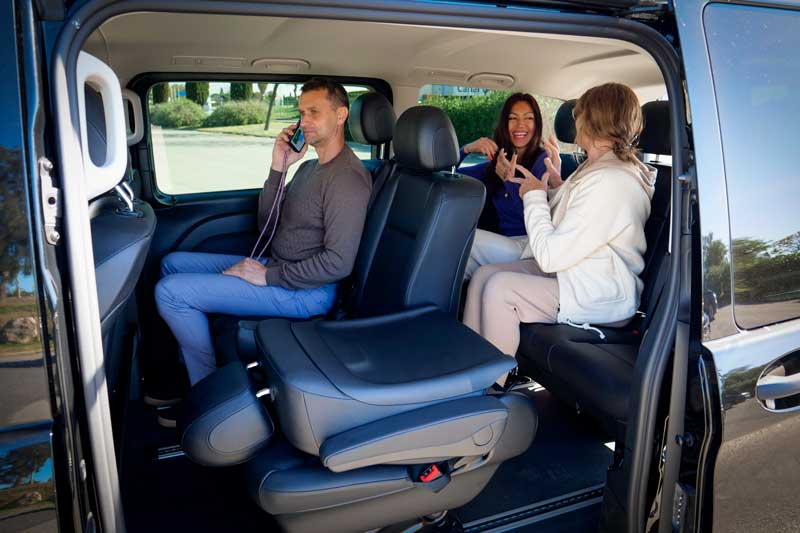 Customers in a luxurious 9-seater rental van